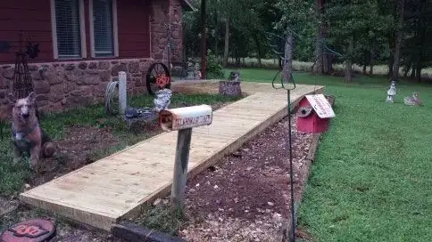 A walkway leading to a mailbox